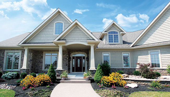 outside view of a family home showing siding in a neutral color